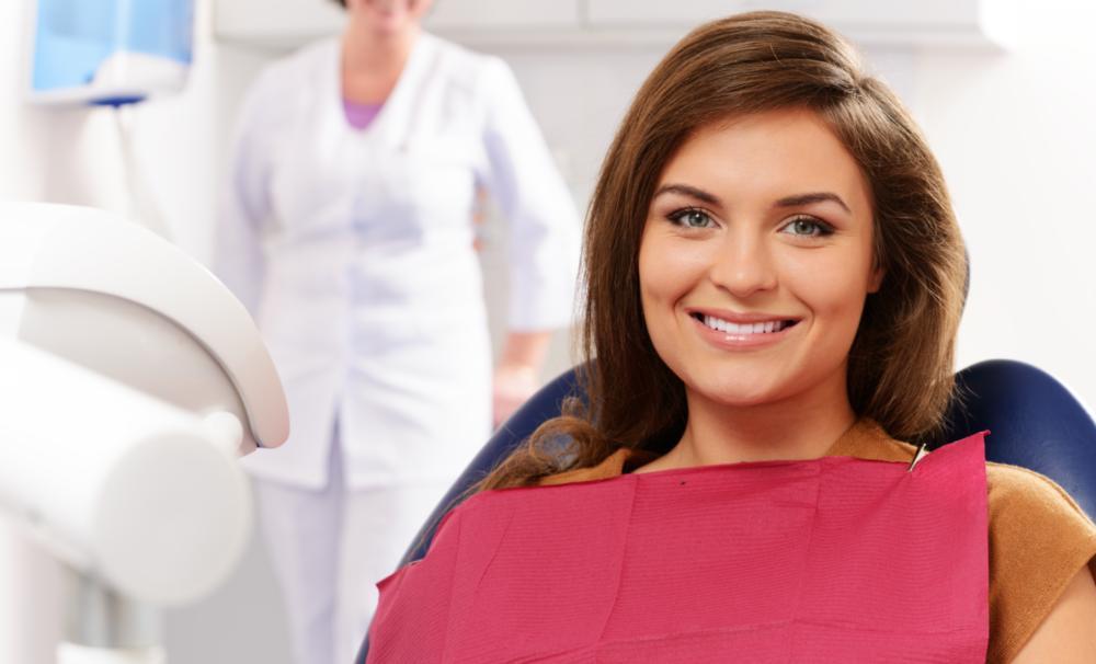 woman smiling sitting in the dental chair