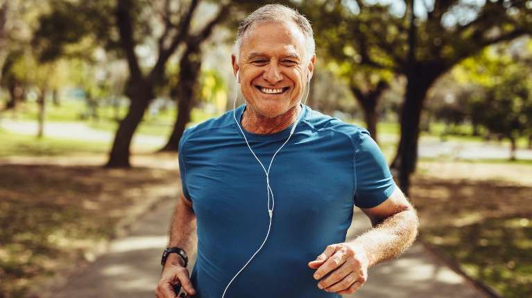 Man smiling after teeth whitening at Dental Solutions